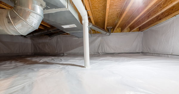 A residential crawl space fully covered in thermoregulatory blankets and boards to help mitigate high radon levels.